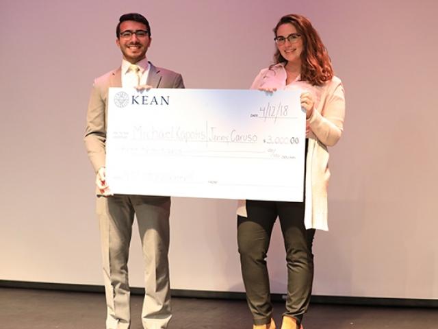 Kean business students pose with the $3,000 prize they received at the Kean Business Plan Competition. (Marketing, Marketing Degree, Management, Management Degree)
