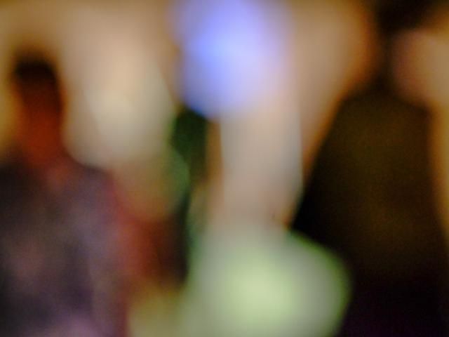 A blurred image of human shapes.