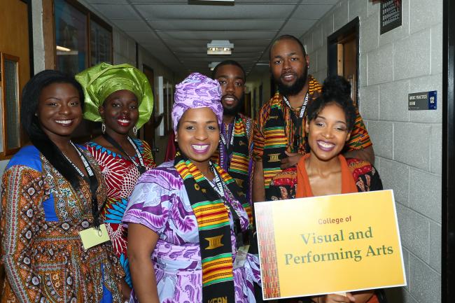students pose in photo for african heritage commencement at kean