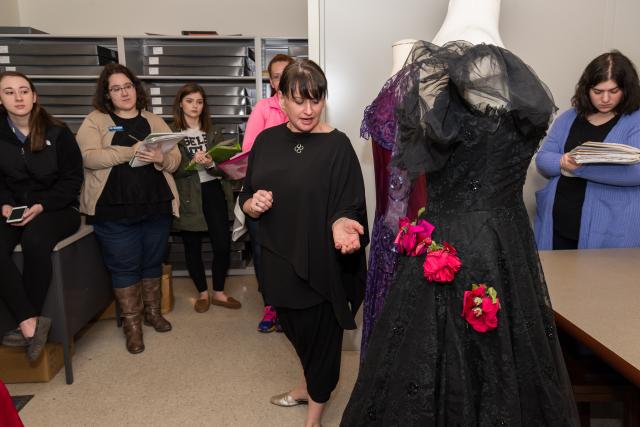 Beth Dincuff guides her class through Liberty Hall’s dress archives. 