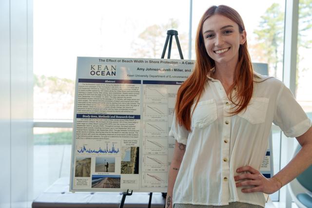 Kean Ocean student proudly displays her research project on shoreline protection