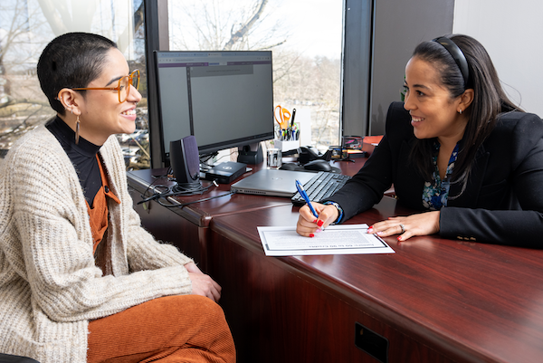 A guidance counselor meets with a student