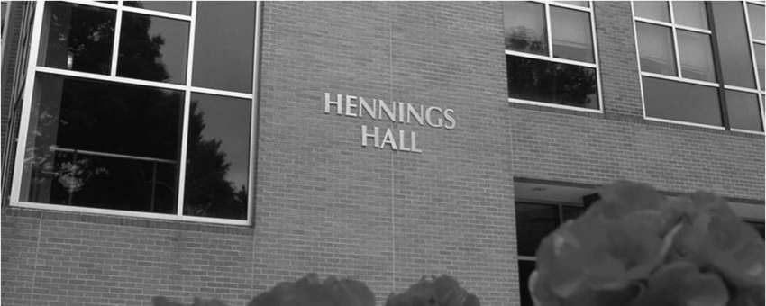 Hennings Hall with red spring flowers