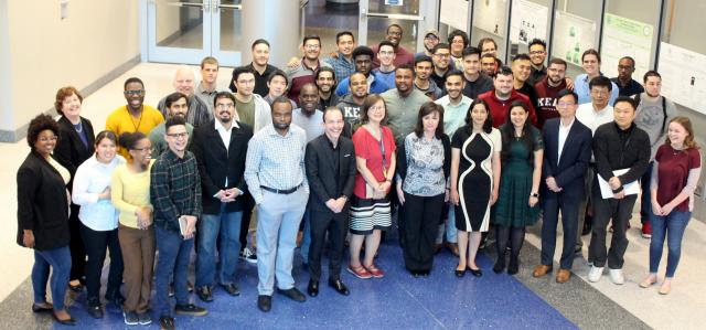 Computer Science Senior Showcase - photo of about 35/40 students and professors.
