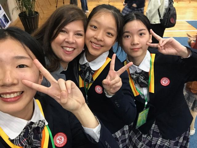 Jersey City principal Martha Osei-Yaw, Ed.D., with students in China
