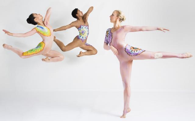 3 Taylor 2 Dance Company performers in mid air jump