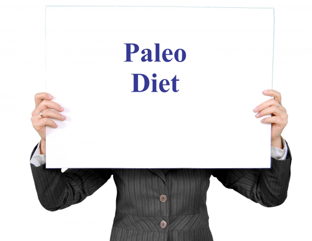 person holding a sign that says "Paleo Diet" (topic of presentation)