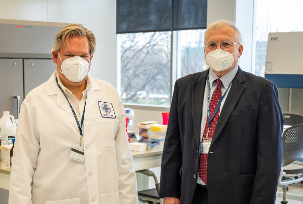 Rob Pyatt, Ph.D., and Keith Bostian, Ph.D., in Kean's COVID-19 diagnostic lab, wearing masks