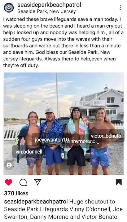 Four young men in beach gear pose along the Jersey shore.