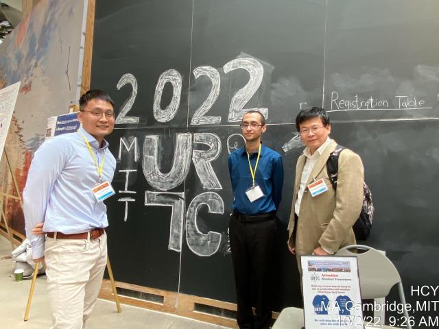 (L-R) Tzu-Han Lin, an Asian male with short black hair, wearing a light blue button-down shirt, with off-white khakis, a brown belt, and round, black glasses. Xavier Amparo, a white male with buzzed brown hair, a peach fuzz beard and mustache, wearing black glasses, a dark blue button-up with black pants. Austin Huang, an Asian male with short, black hair, wearing a cream colored suit jacket, a white button-up, and glasses. All three gentlemen are wearing a yellow lanyard with a clear, square name tag holde
