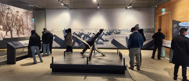 Students walking around a World War 2 museum