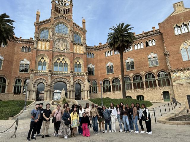 Students standing in front of a university in Spain