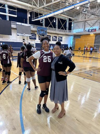 A student and her sister, a Kean employee, pose at the volleyball clinic.