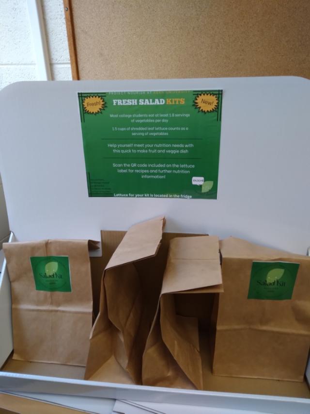 A photo of salad kit bags -- with lettuce grown at Kean