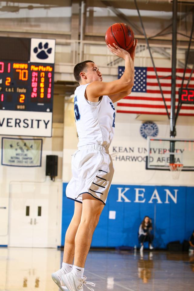 Stephen Strom playing basketball at Kean