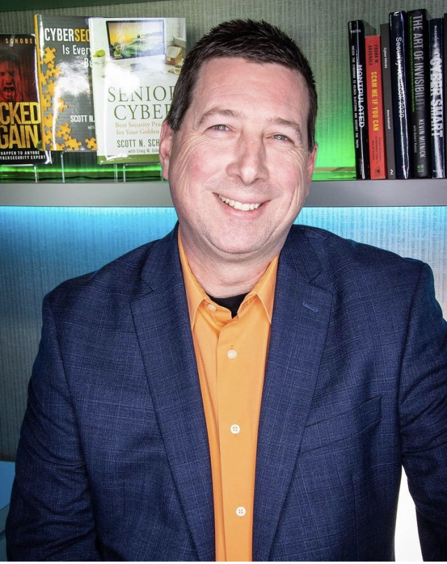 Scott Schober_man wearing orange button down shirt and navy blazer