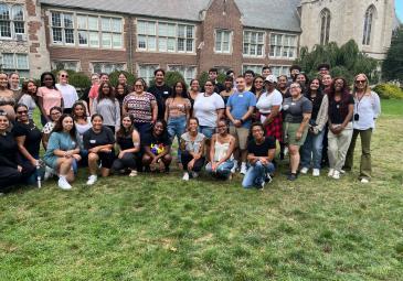 A group photo of students taken in front of a building. 