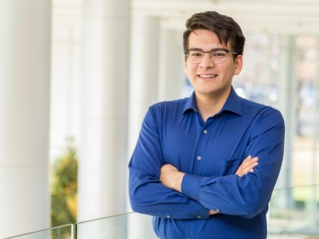 Victor Suarez standing with arms crossed