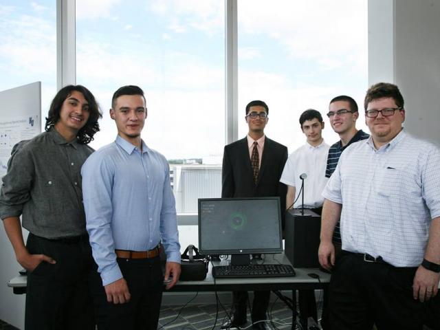 Kean professor David Joiner, Ph.D., pictured here with his students, is an expert on infusing computational science into secondary school and undergraduate curricula.