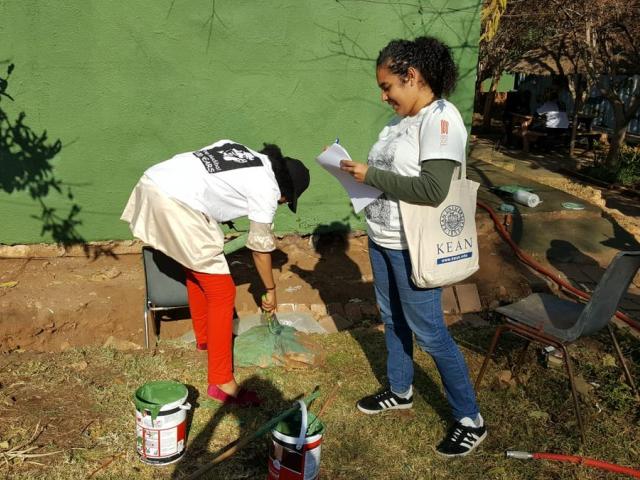 Kean student Natalie Hernández interviews a volunteer in South Africa.