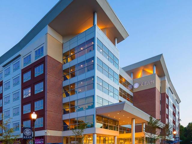  image of cougar hall at night from outside of building