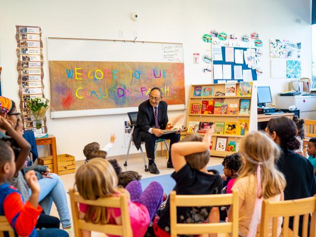 Kean President Dawood Farahi reads to a pre-school class on campus.