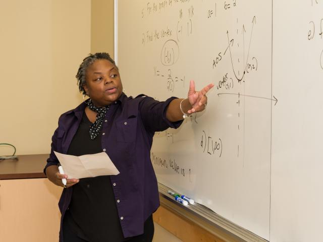 Kean adjunct math professor Irisa Leverette instructs students in algebra.