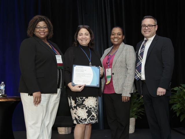 Kean University Nursing faculty pose with their nursing Excellence in Scholarship Award