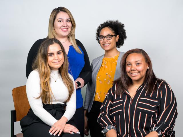 Four young woman pose