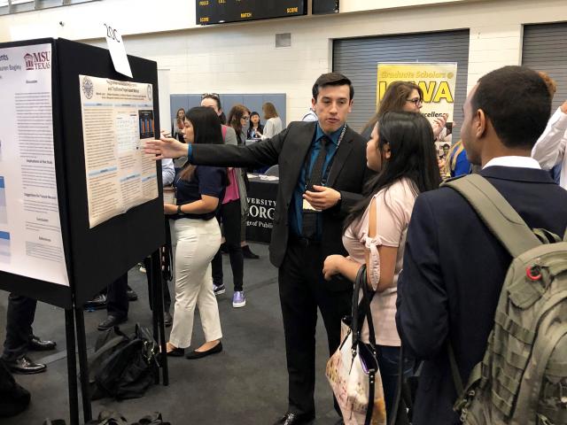 Kean University student Mitchell Lanzl presents his research at the NCUR conference