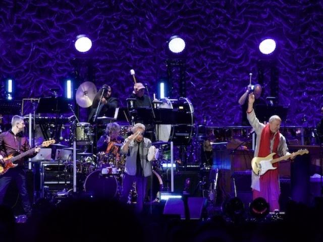 Rock band The Who on stage at MSG. Pete Townshend is seen doing signature move. Kean Adjunct James Musto III plays percussion in the background.