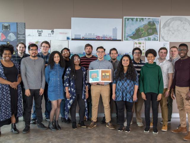 Kean Architecture students pose with architectural renderings