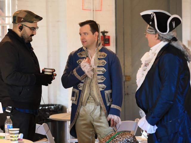 Liberty Hall 360 co-director Manny Vozos consults with actors in the film.