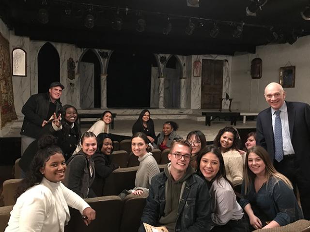 Kean Adjunct English Professor Jeffrey W. Herrmann in a theatre with his Shakespeare Survey class