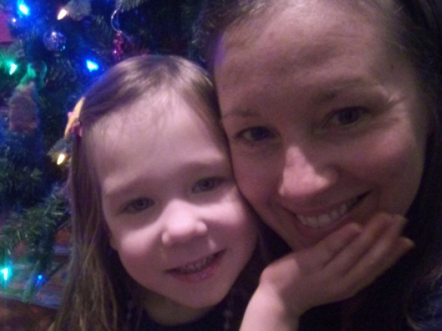 Suzanne Barich and her daughter, Addison, taking a Christmas photo.