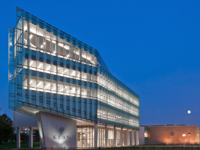 Kean University's STEM building illuminated at night.