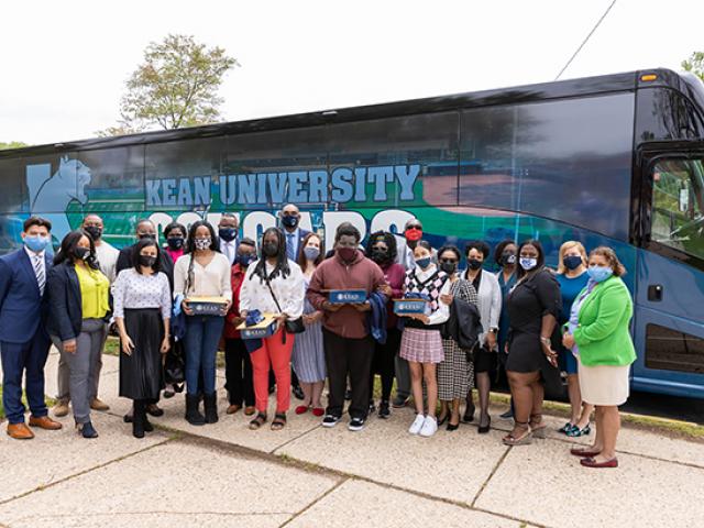 Kean University leaders traveled by bus to accept students to the Kean Scholar Academy