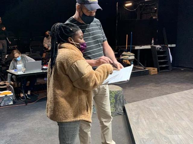 Year One director John Wooten works on stage with artistic and literary intern Latisa Harriott, a graduate of Kean University