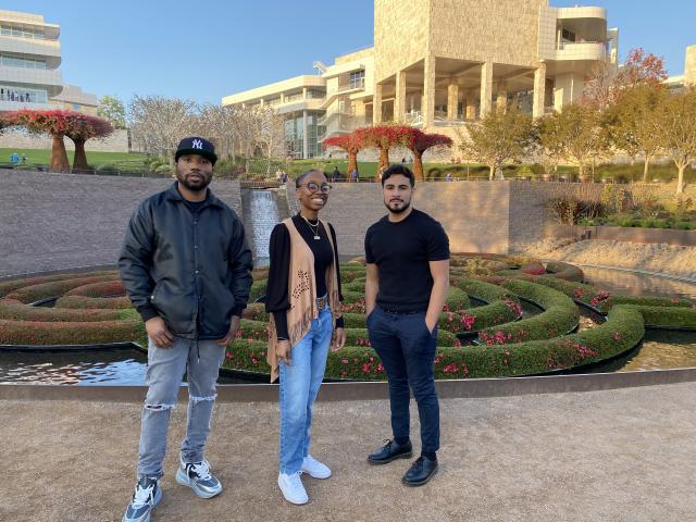 Artist Knowledge Bennett stands with students Nazira Goldware and Brandon Bravo at the Getty Center and Museum in LA