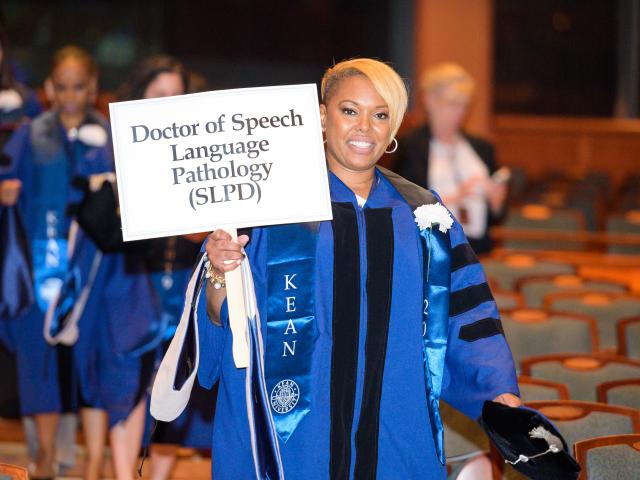 A procession of doctoral students takes part in Kean Commencement in 2019.