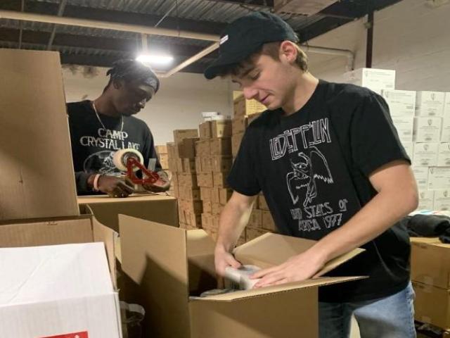 DormlyBox co-founders Jaelen Hymes and Jared Shiffman pack boxes