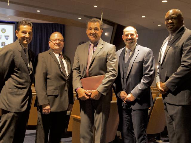 Kean public safety and administration officials pose with the Union County prosecutor.