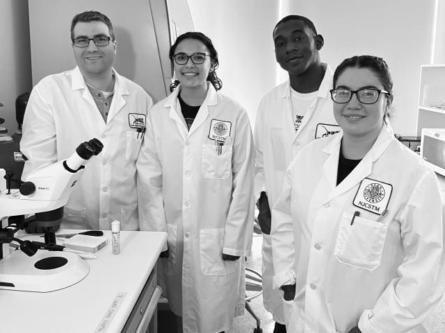 Matt Niepielko is pictured with three Kean student researchers in the lab