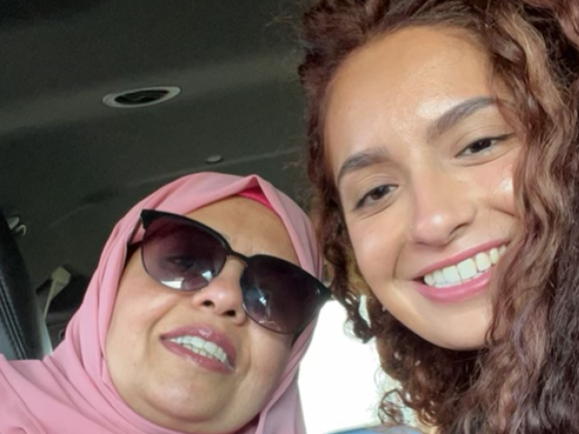 Kean alumna Rabia Ashraf and her mother posing for a selfie in a car