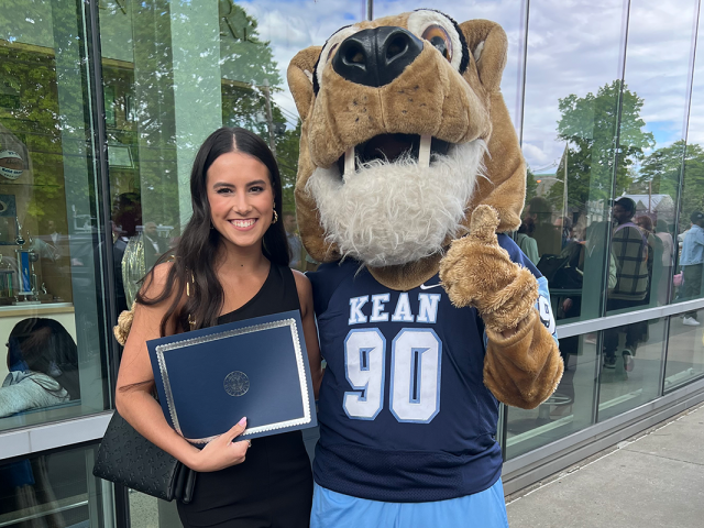 Megan Braine poses with Kean's cougar mascot, Keanu.