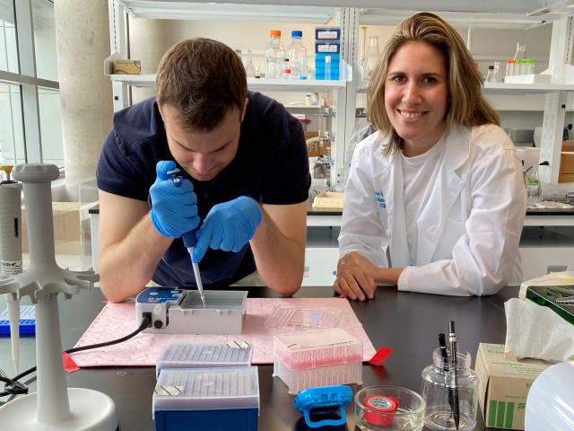 Brenna Levine working in the lab with student Nicolas Largotta, a junior molecular and cell biology major 
