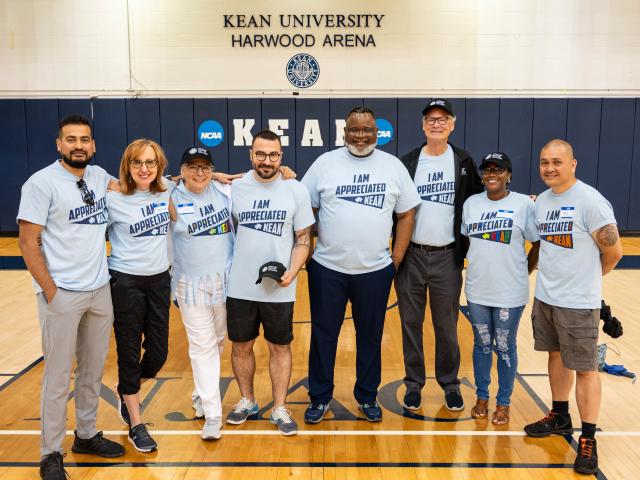 Kean employees gather with President Repollet in Harwood Arena