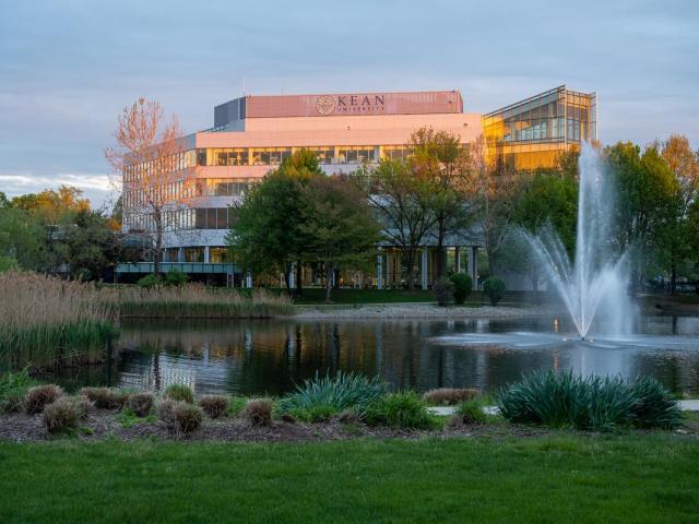 STEM Building at dusk with fountain