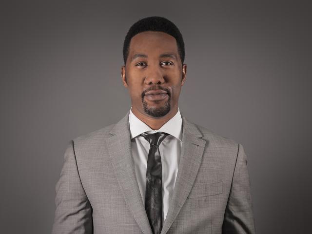 Head and shoulders shot of Ndaba Mandela, wearing a suit. He is Nelson Mandela's grandson.