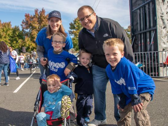 Family with four children on Kean campus during an alumni event